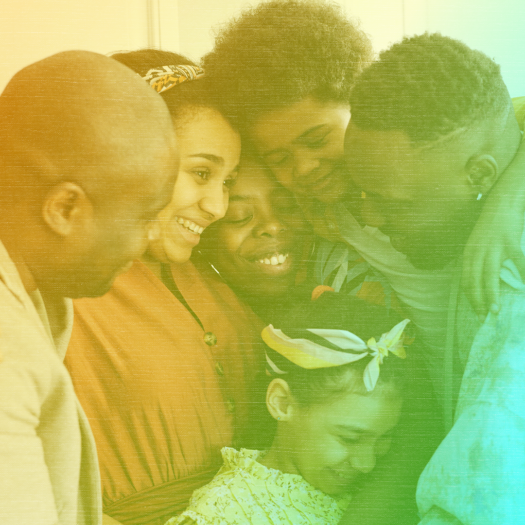 Greenish-yellow colorized photo of a Black family of six including a few young kids hugging each other.