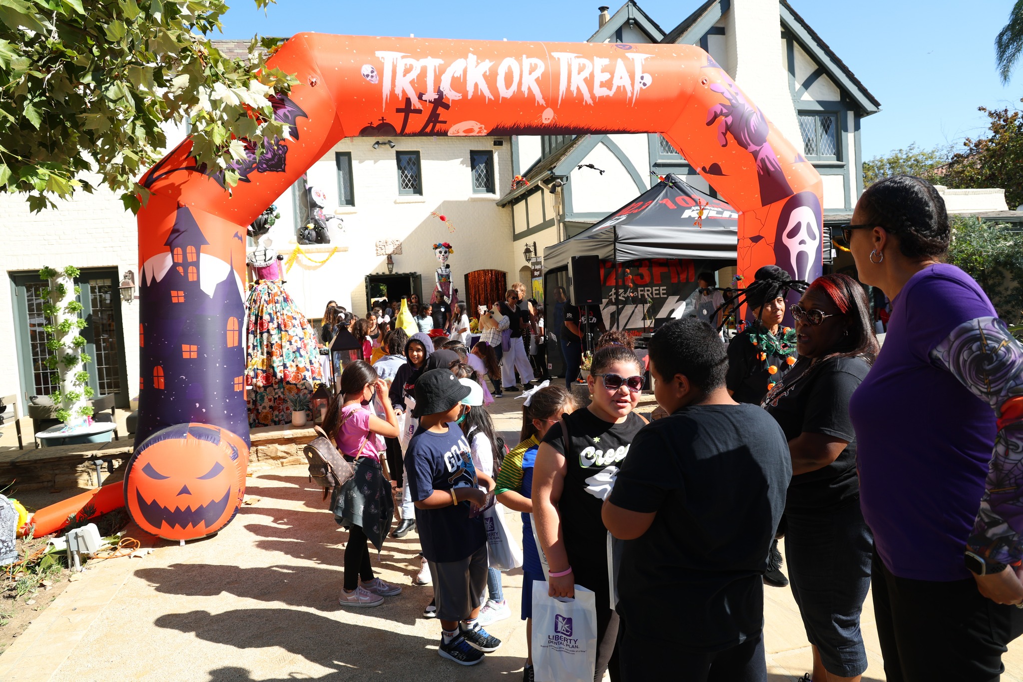 Community members visit a CAAASA Halloween even to promote child vaccinations.