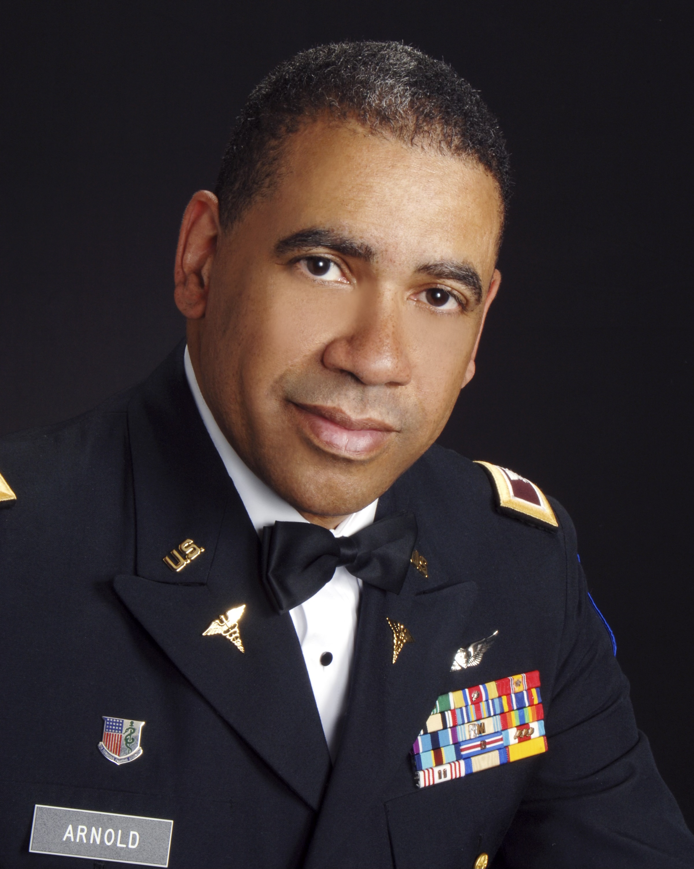 Professional headshot of a Black man wearing his military uniform