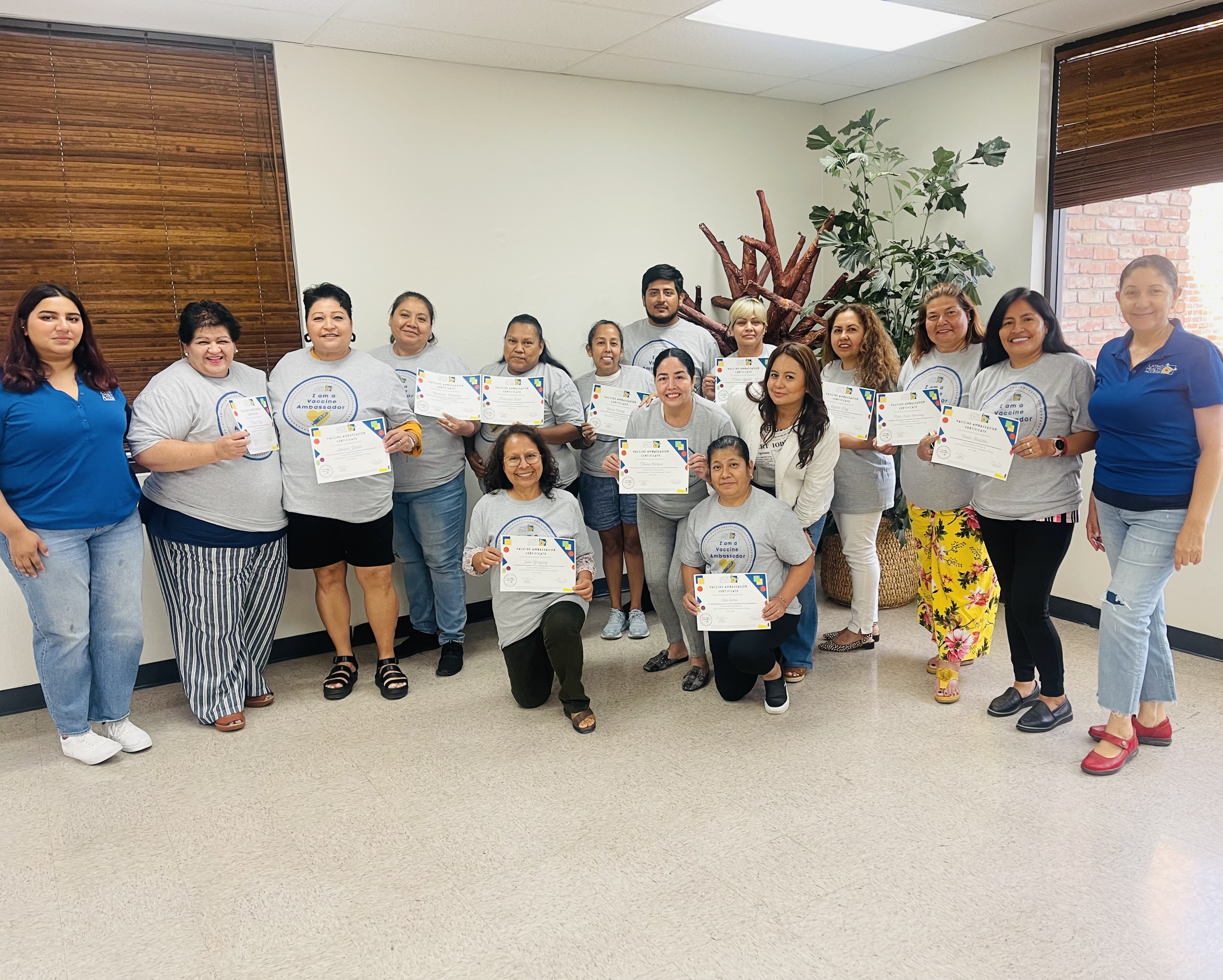 LHA staff members hold certificates