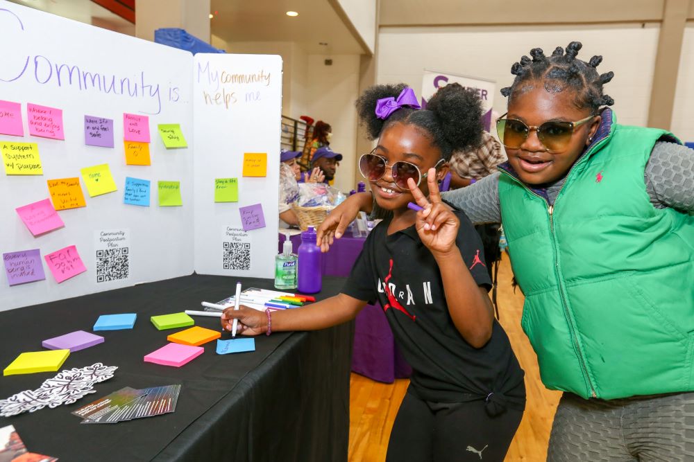 Young attendees post their reflections on the meaning of community.