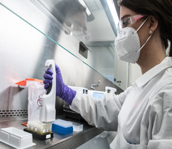 A person works at a lab bench.