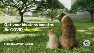 Two dogs sit side by side in a grassy park. Text reads, "Get your bivalent booster. Be COVID akamai."