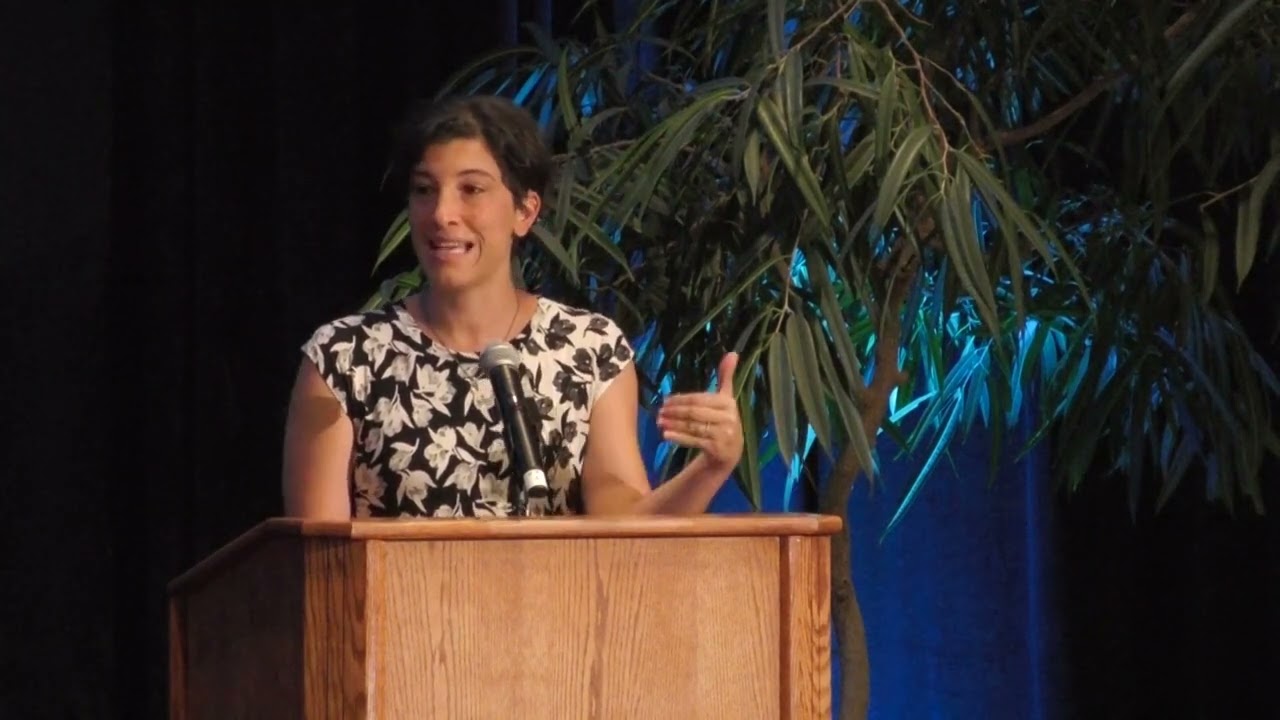Renée DiResta speaks at a podium 
