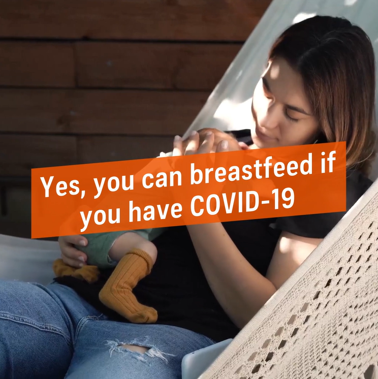 A woman on a hammock holding a small infant with text in a box that says yes, you can breastfeed if you have COVID-19. This is from the beginning of the video.