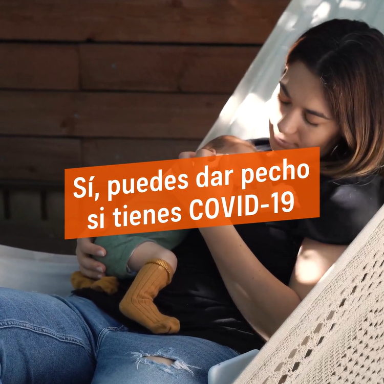 A woman on a hammock holding a small infant with text in a box that says in Spanish yes, you can breastfeed if you have COVID-19. This is from the beginning of the video.