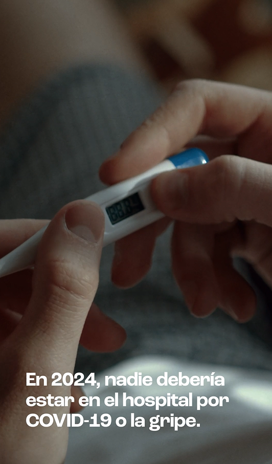 image of a person holding a thermometer