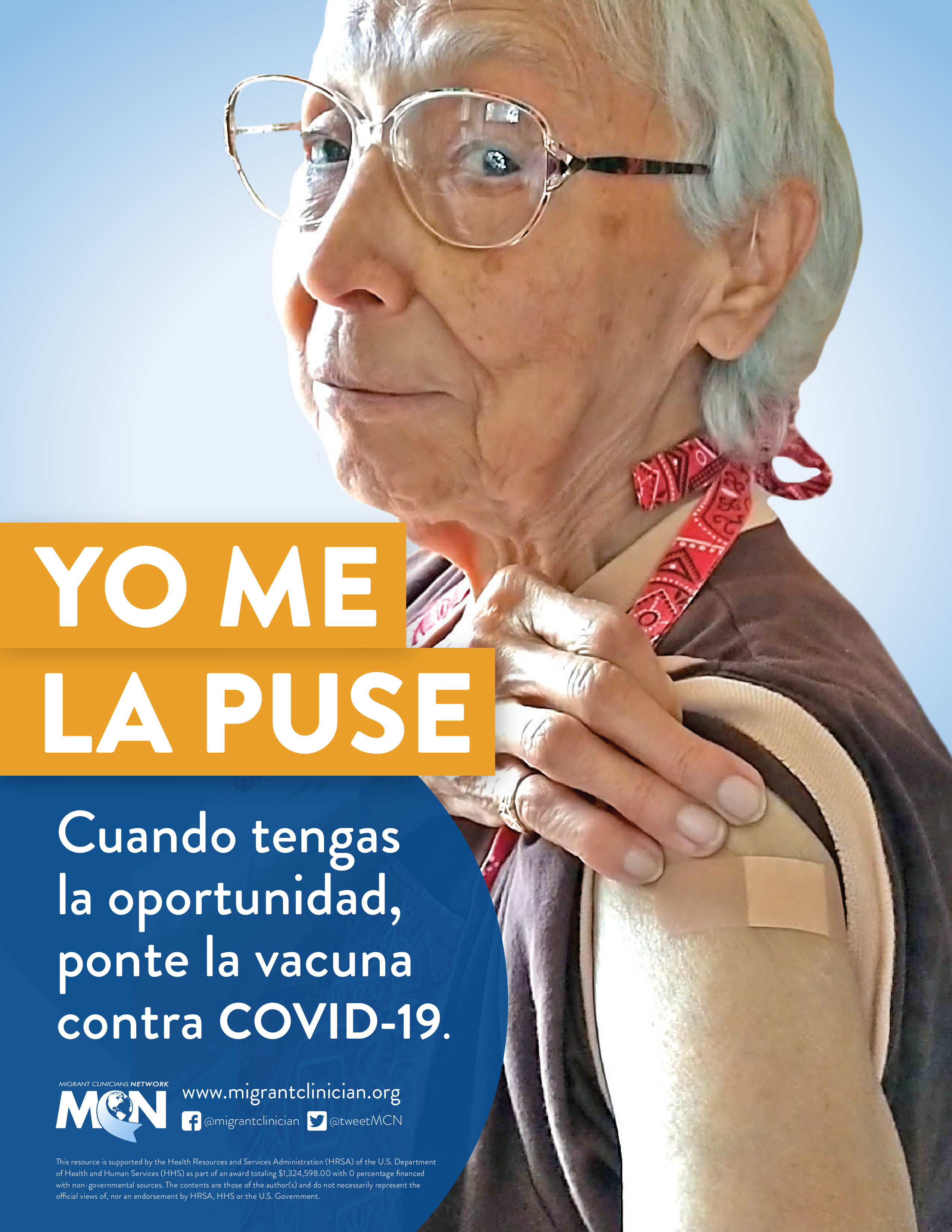 Older woman with glasses proudly shows off her vaccination.