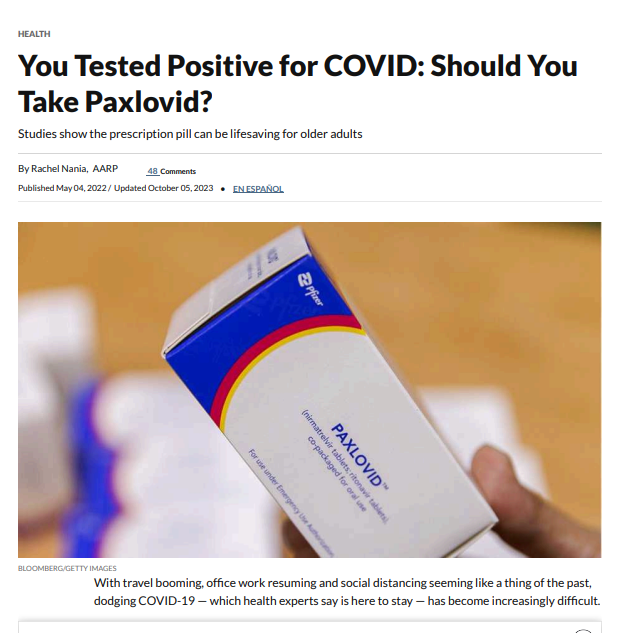 Website includes an image of a person holding Paxlovid medication