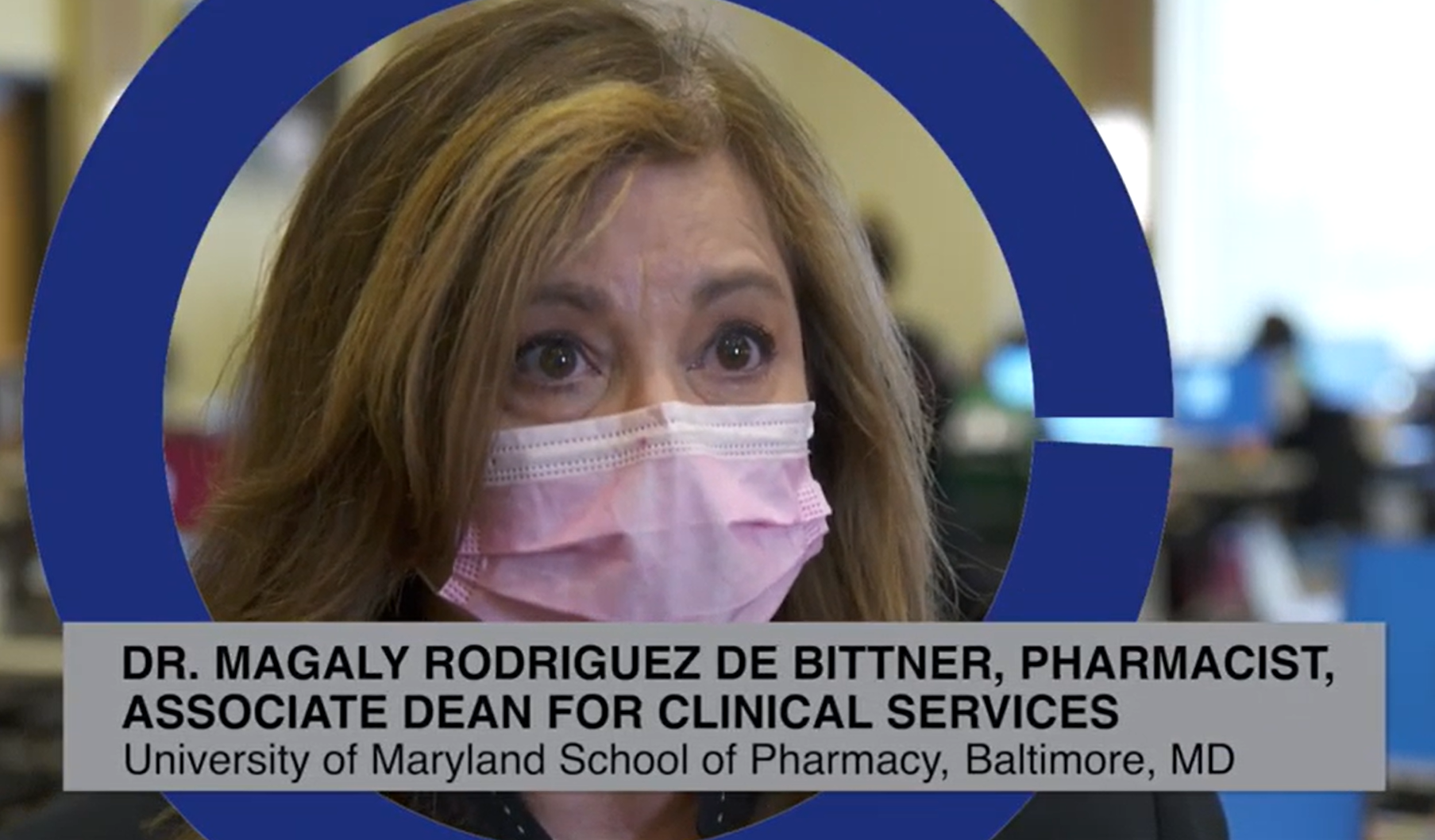 A Latinx pharmacist wears a mask
