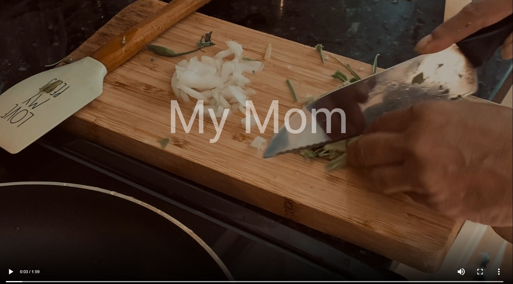 Afifah's mothers hands cutting up herbs for dinner. Title reads "My Mom"