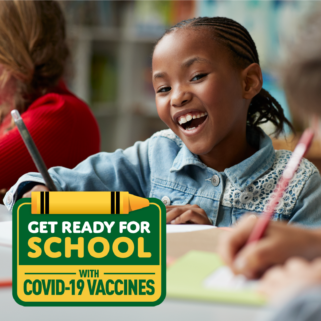 A young Black girl smiles and sits at a desk with a pencil. Logo in bottom left reads "Get ready for school with COVID-19 vaccines"
