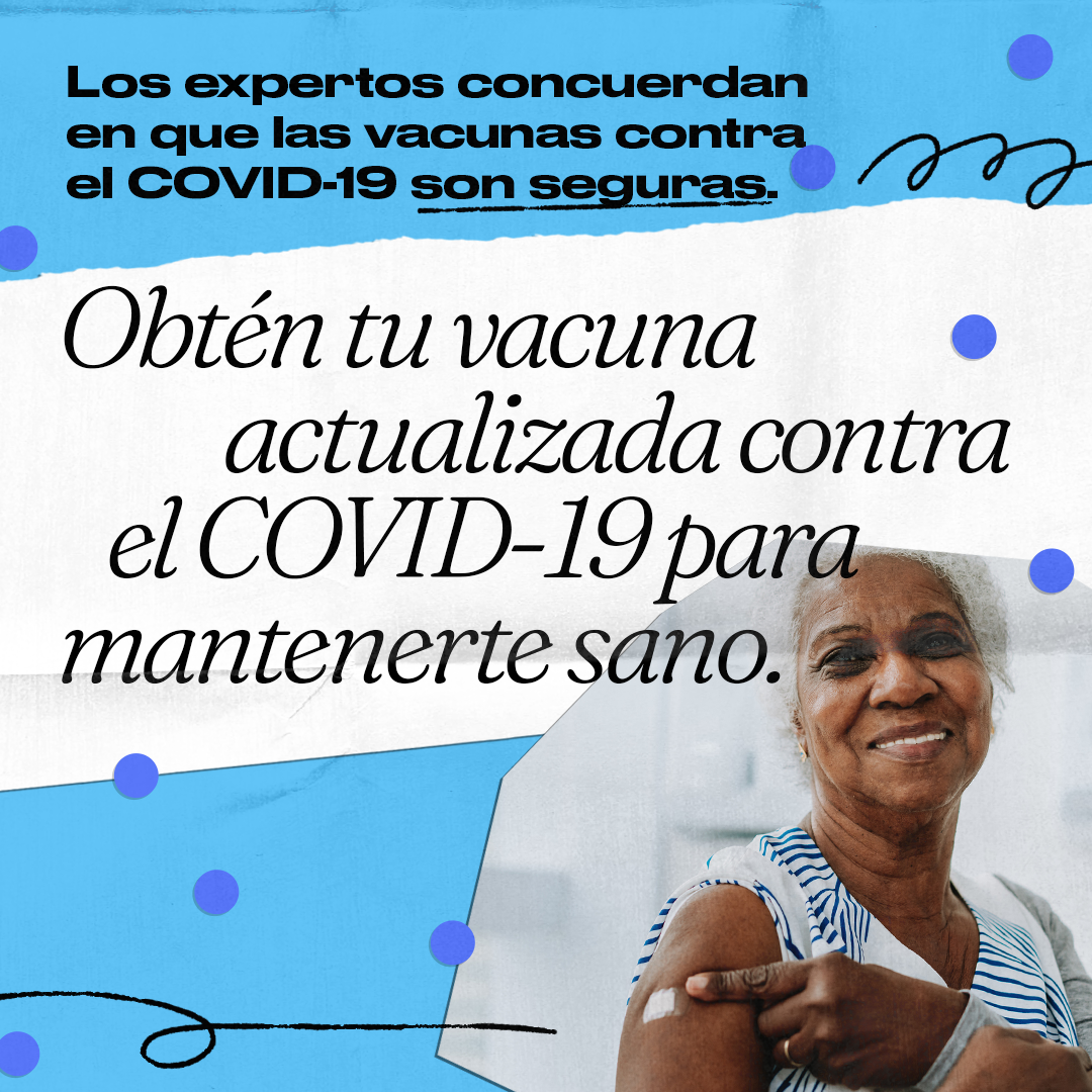 A Black older woman smiles and points to an adhesive bandage on her shoulder. Spanish text reads, "Experts agree the COVID-19 vaccines are safe. Get your updated COVID-19 vaccine to stay healthy."