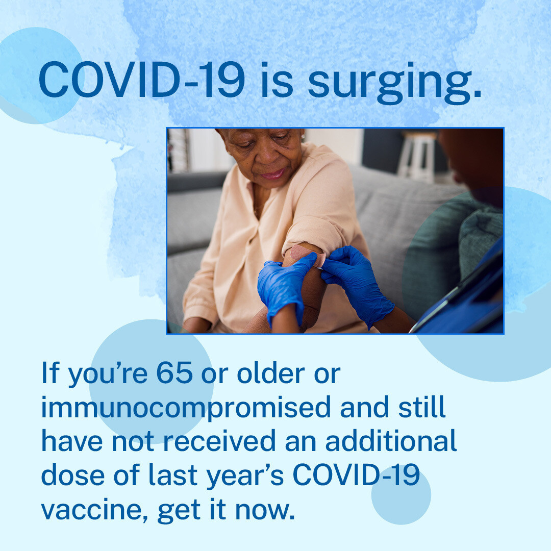 An older Black woman gets an adhesive bandage on her arm from a Black healthcare provider. Text reads, "If you're 65 or older or immunocompromised and still have not yet recieved an additional dose of last year's COVID-19 vaccine, get it now. "