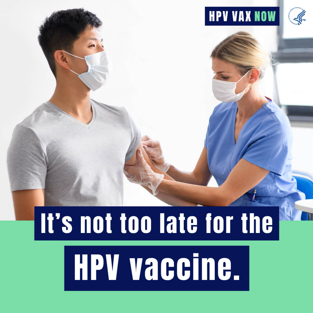 A young Asian man gets ready to receive a vaccine from a white female healthcare worker. Text reads, "It's not too late for the HPV Vaccine. HPV VAX Now."