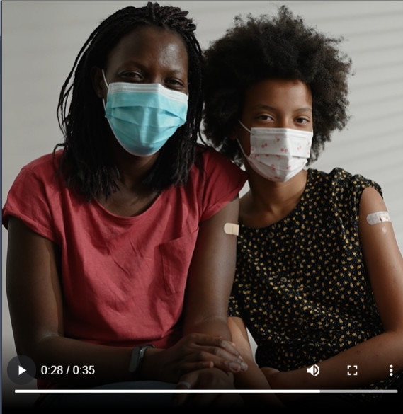 two black women wearing masks