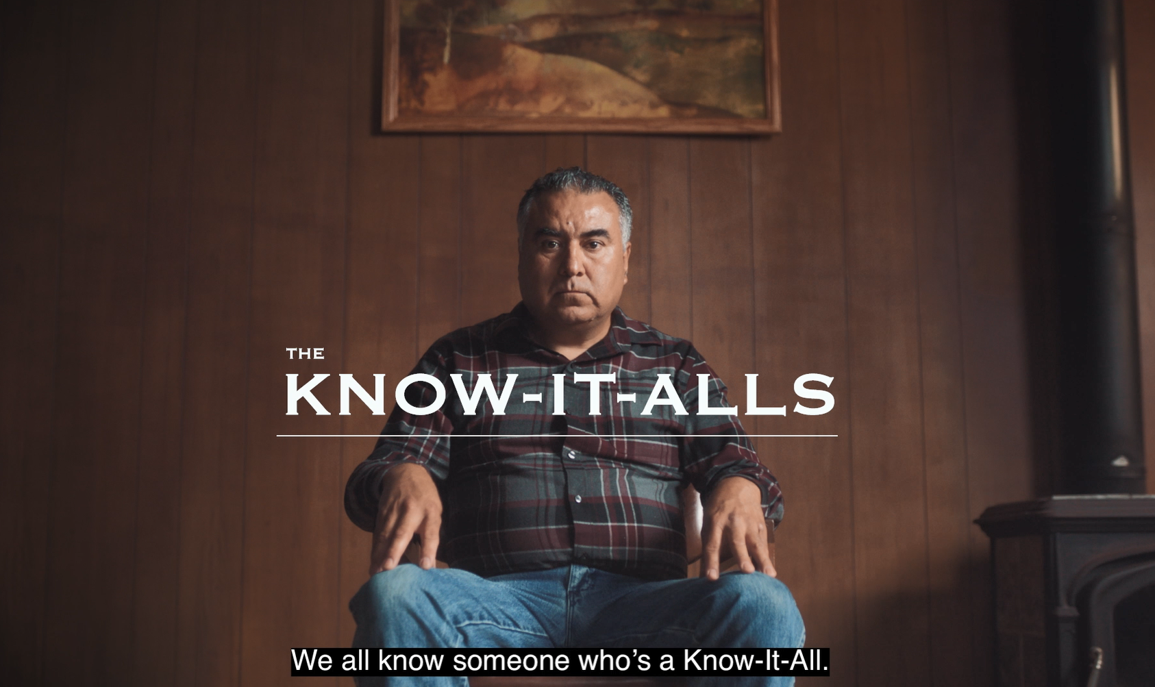 A Hispanic/Latino man sits in a chair in a wood-paneled room. The title reads, "The Know-It-Alls." Captions read, "We all know someone who's a Know-It-All."