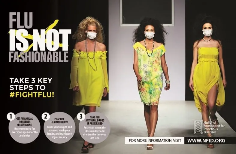 three models on a runway wearing masks with the text "flu is not fashionable"