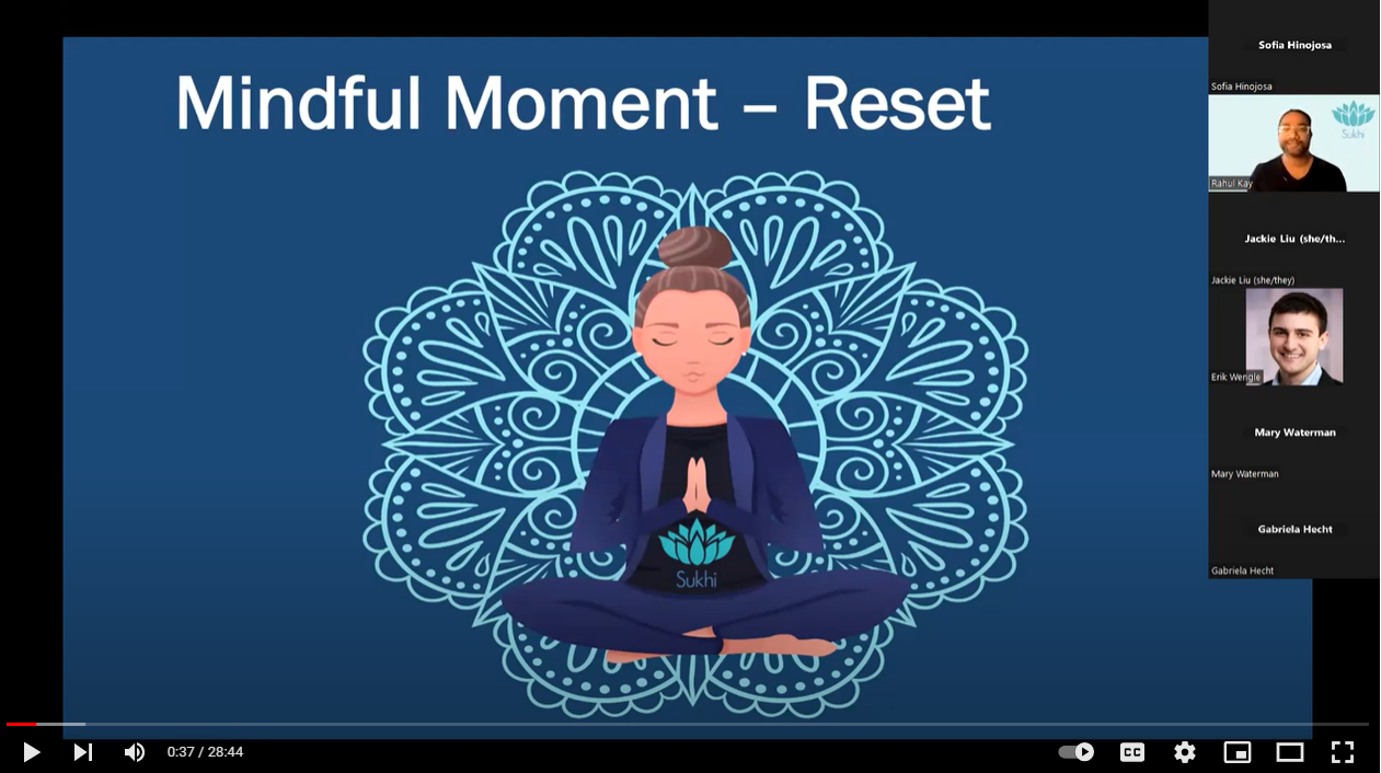 Cartoon illustration of a young woman practicing mindfulness meditation. She is sitting with her legs crossed and her hands in a prayer position