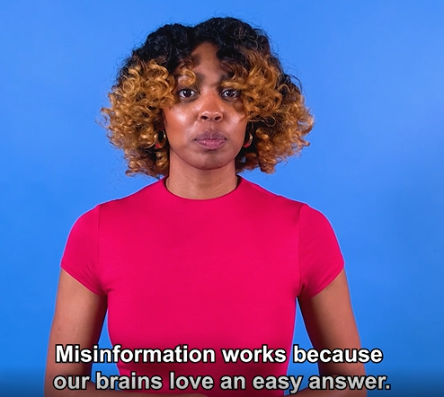 A Black woman discusses misinformation with a blue background