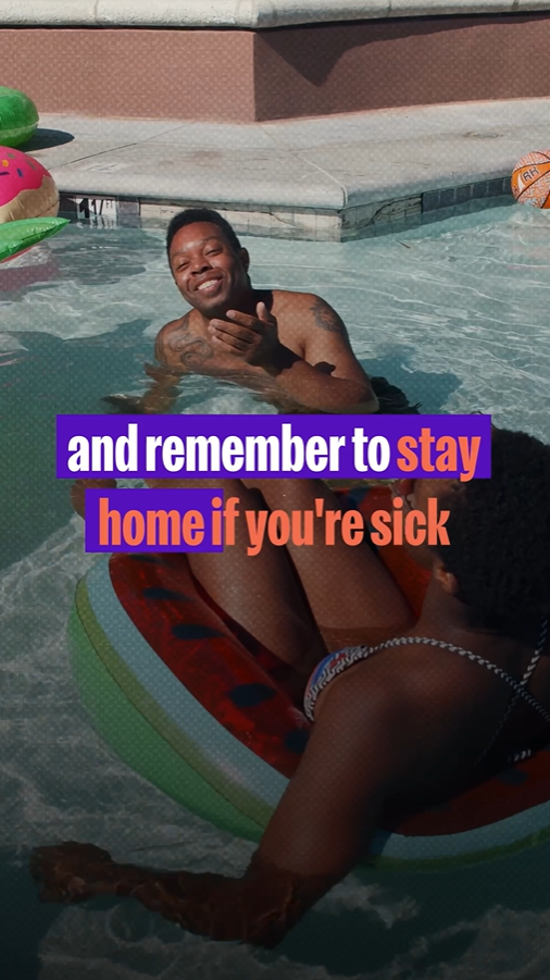 Video still shows two Black people laughing together in a pool.