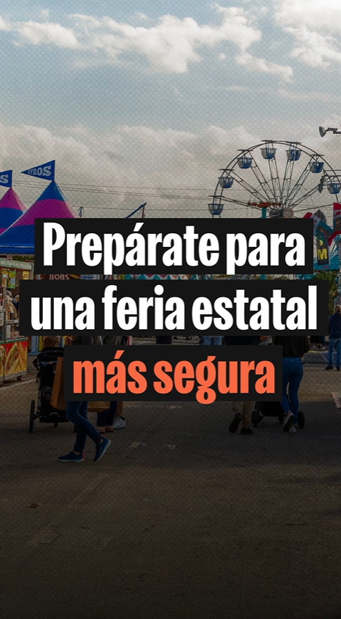 Video still shows text reading "preparate para una feria estatal mas segura" (or "prepare for a safer state fair" in English) over an image of people walking and pushing strollers surrounded by carnival tents and a Ferris wheel.