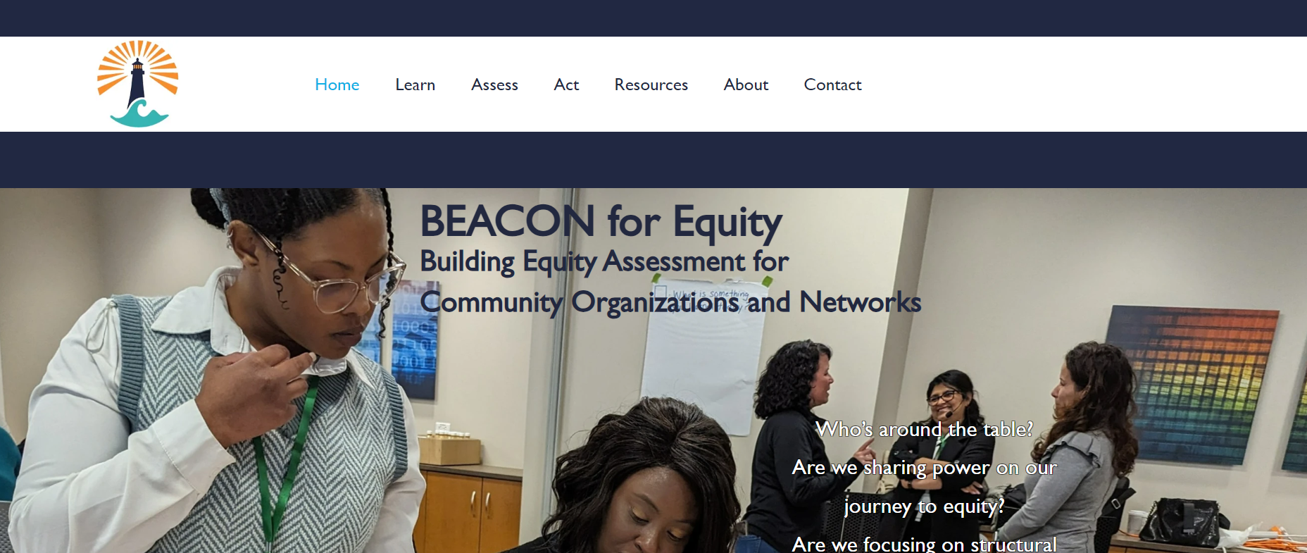 Website homepage shows two Black women collaborating at work.