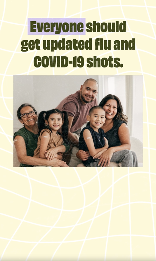 Video still shows an image of a family of color - an older woman, two children, and two adults - sitting on a couch together and smiling. They have band aids on their arms.