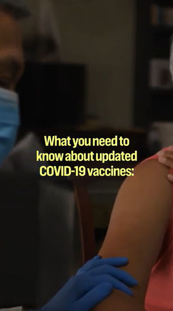 Video still shows text over the image of a woman's arm about to receive a vaccine by a health care provider in a mask and blue gloves.