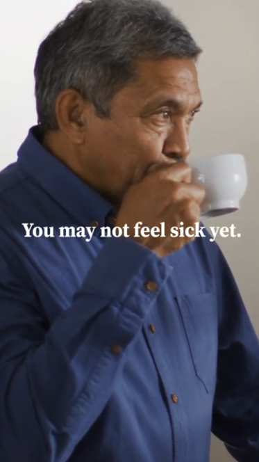 Video shows clips of different people doing daily activities: drinking coffee, grocery shopping, and spending time with family. Text reads: "You may not feel sick yet. But you may already be spreading the flu to others around you… including the most vulnerable in your familia.” Final clip shows a doctor and text that reads: “Get vaccinated today to help keep your familia protected."