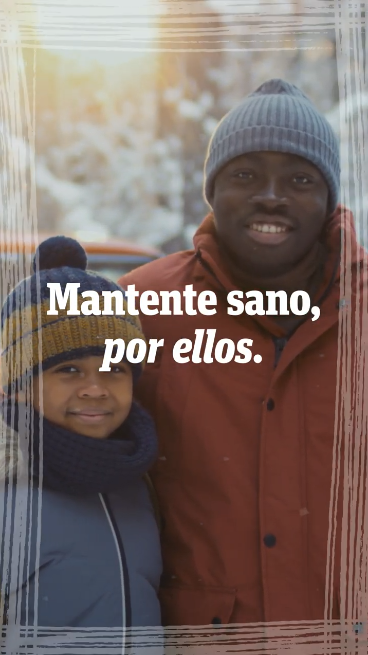 Video shows clips of family members spending time together: playing outdoors, sledding, and baking. Text overlaid on the clips reads: “Stay healthy. For them. COVID-19 is still a serious threat. Protect your time with loved ones this new year. Stay up to date on vaccines. Talk to your doctor or pharmacist today.”