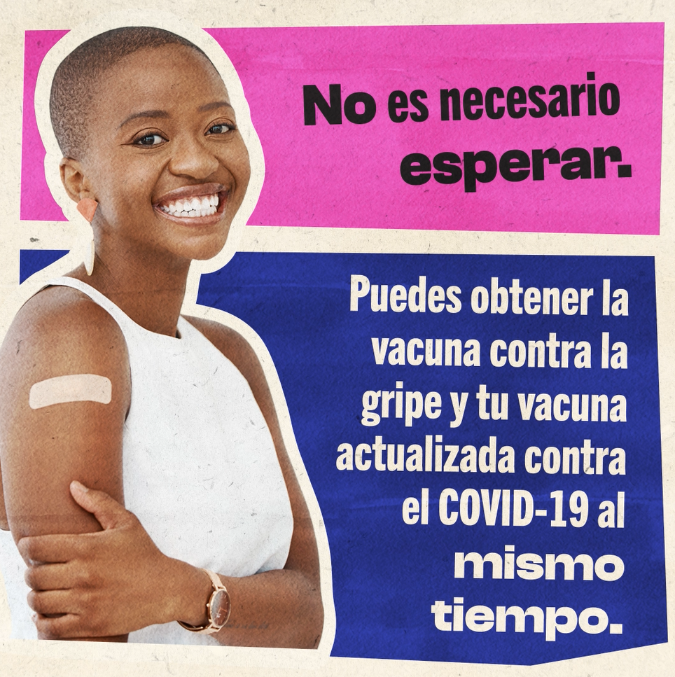 Video displays a person of color smiling broadly with a band aid on their arm.