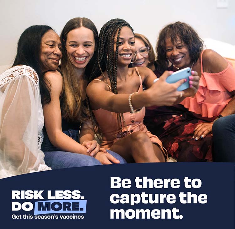 group of black women taking a selfie photo with a cell phone