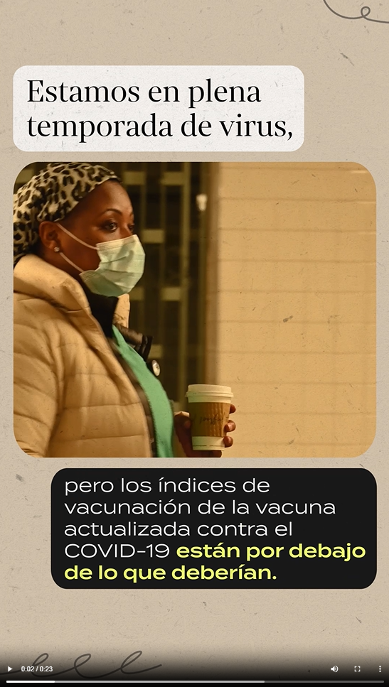A Black woman wearing a mask holds a cup of coffee