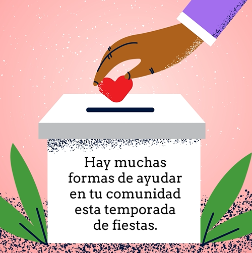 A tan hand is dropping a heart into slit at the top of a white box with black text in Spanish on the front. The box is sitting on the ground with leaves around it.