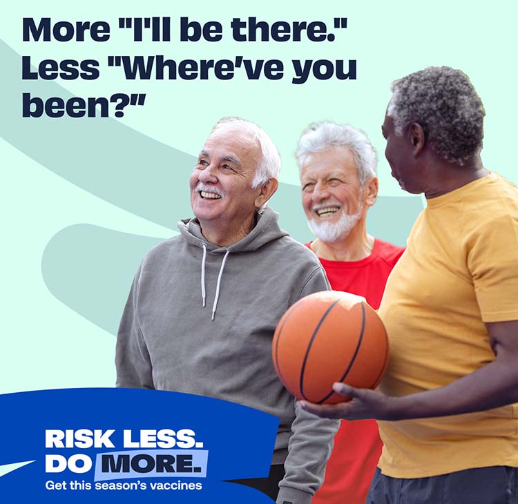 group of older men holding a basketball