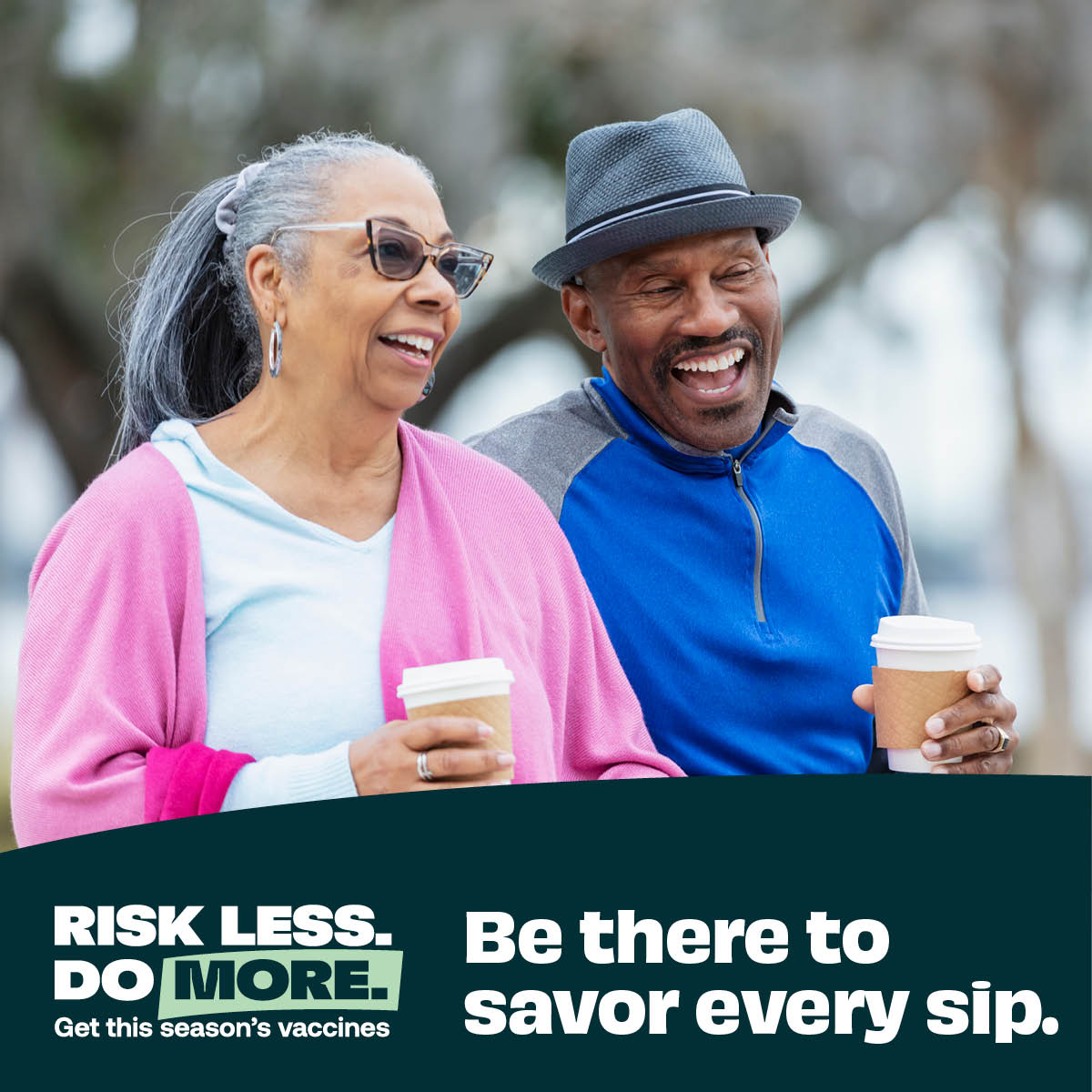 a man and a woman holding coffee cups