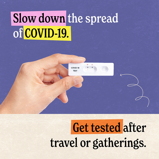 A white person's hand holds a COVID-19 at-home test.
