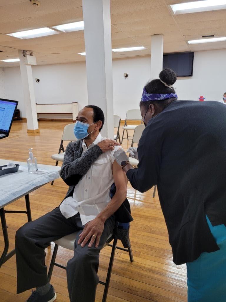 Bishop Arthur Jack being vaccinated at his church, Holy Tabernacle Church in Boston