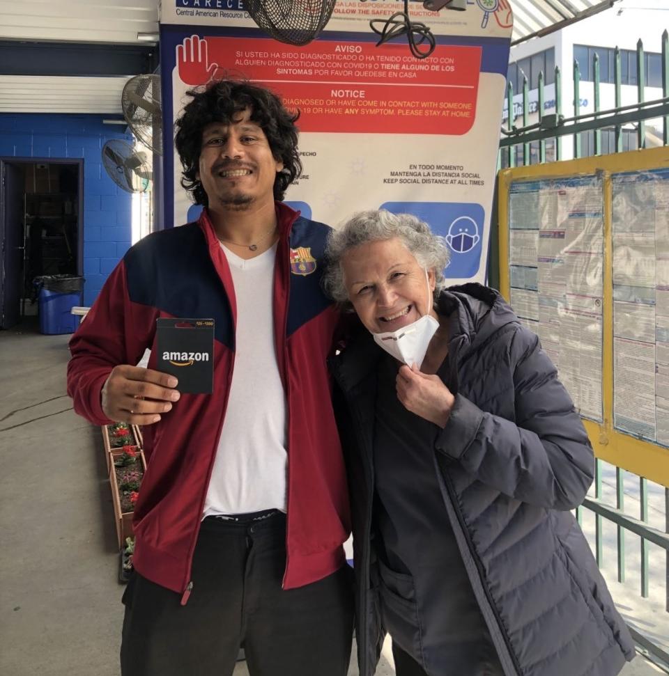 An man and older woman smile