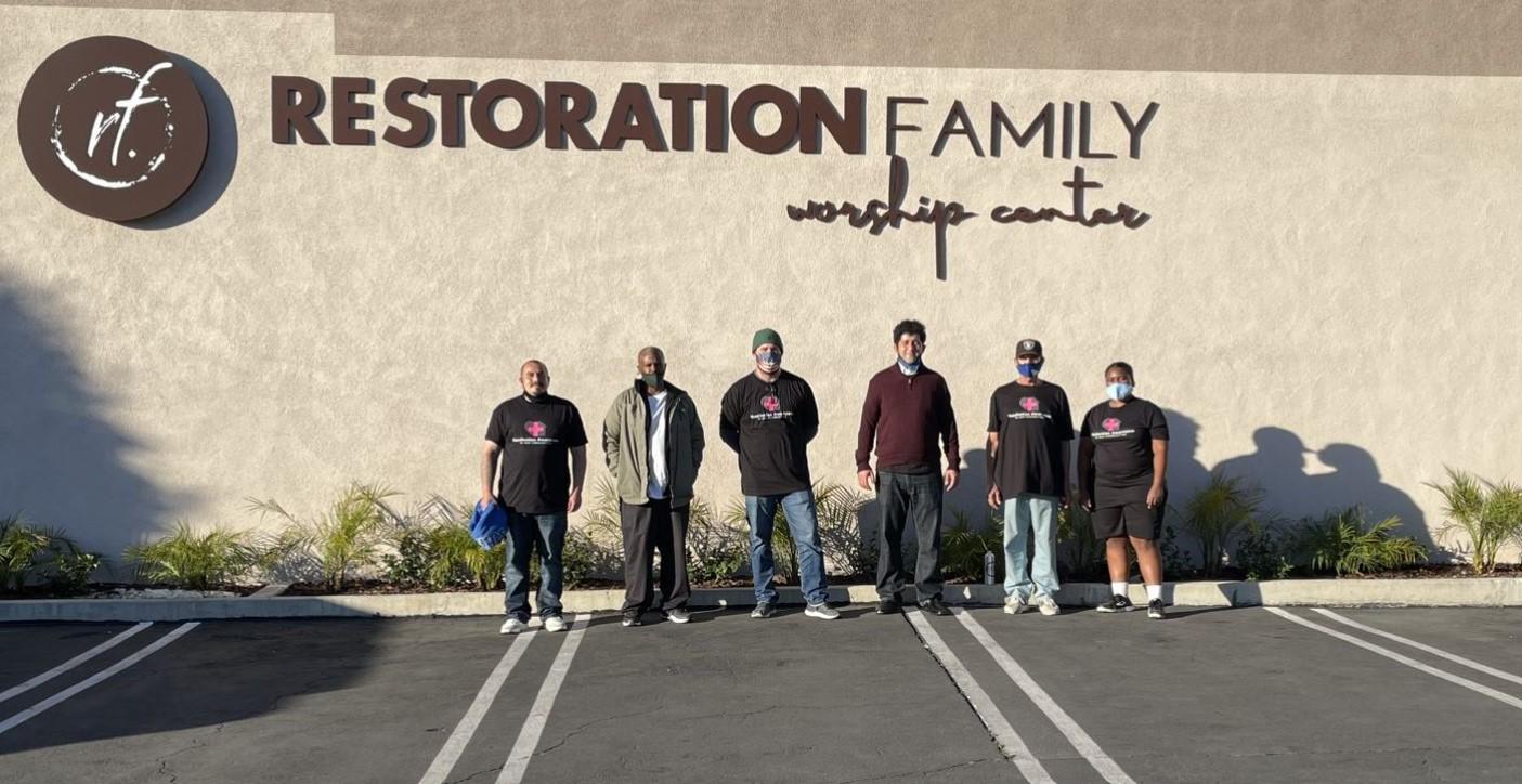 CCM members outside of a worship center